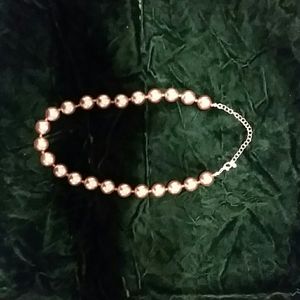 Reflective gold toned necklace